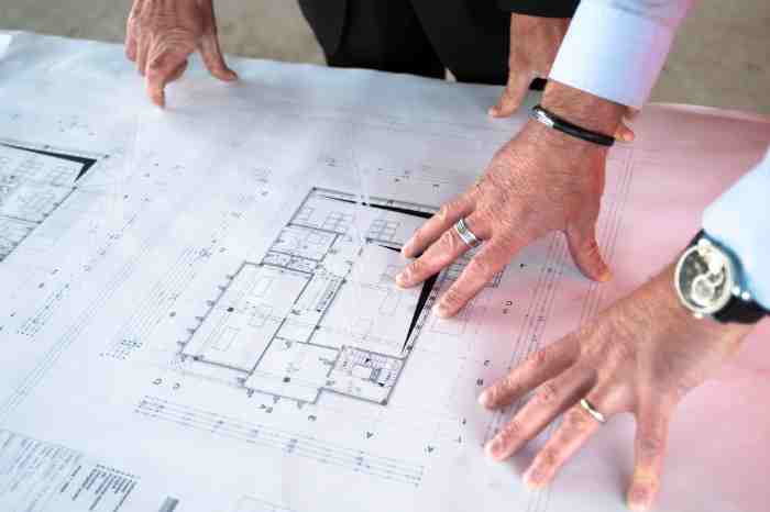 Two people going over design plans